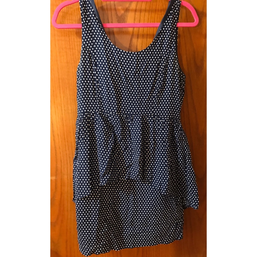 Blue and white polka dot dress with peplum accent